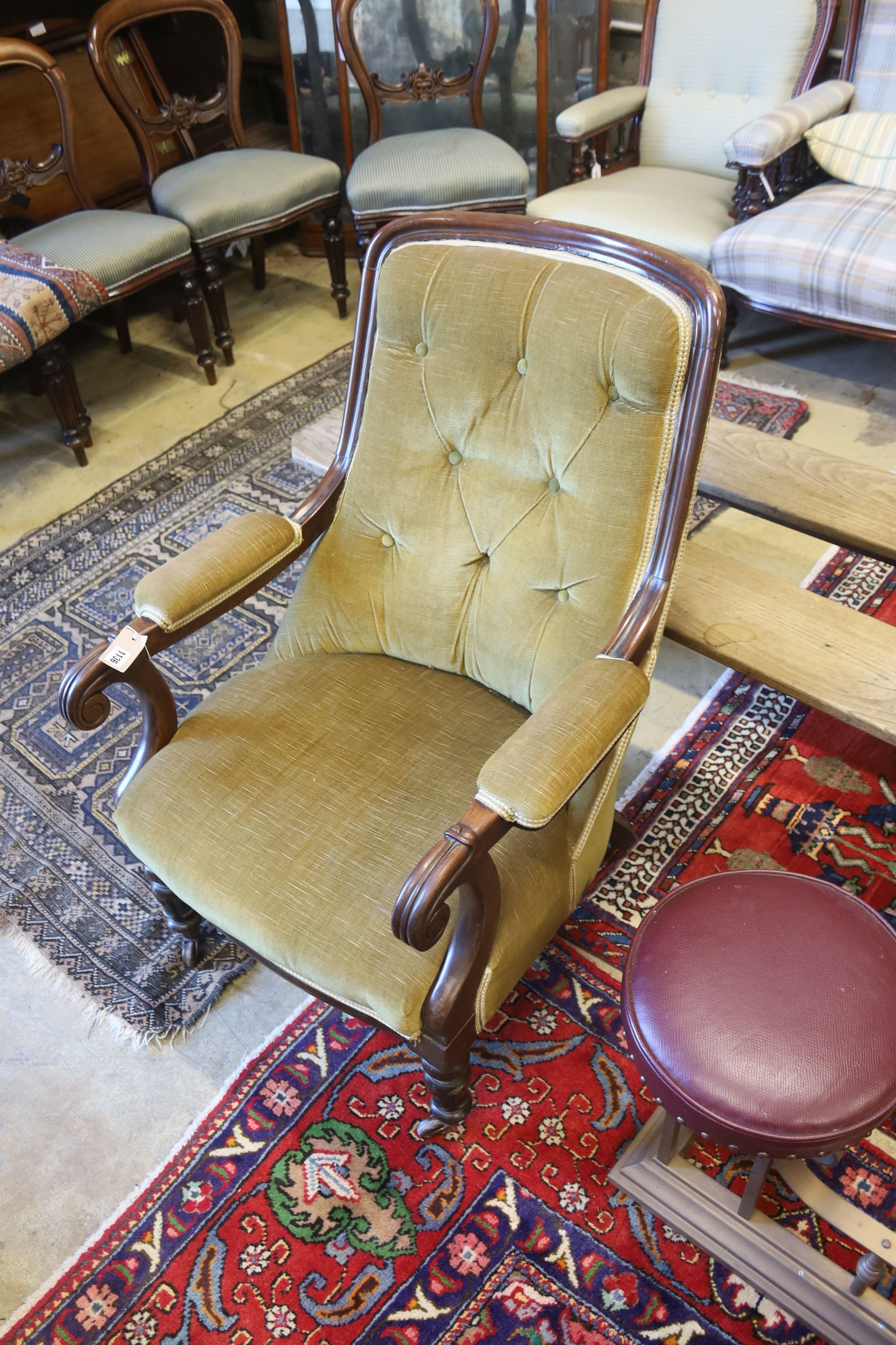 A Victorian mahogany upholstered open armchair, width 65cm, depth 70cm, height 94cm